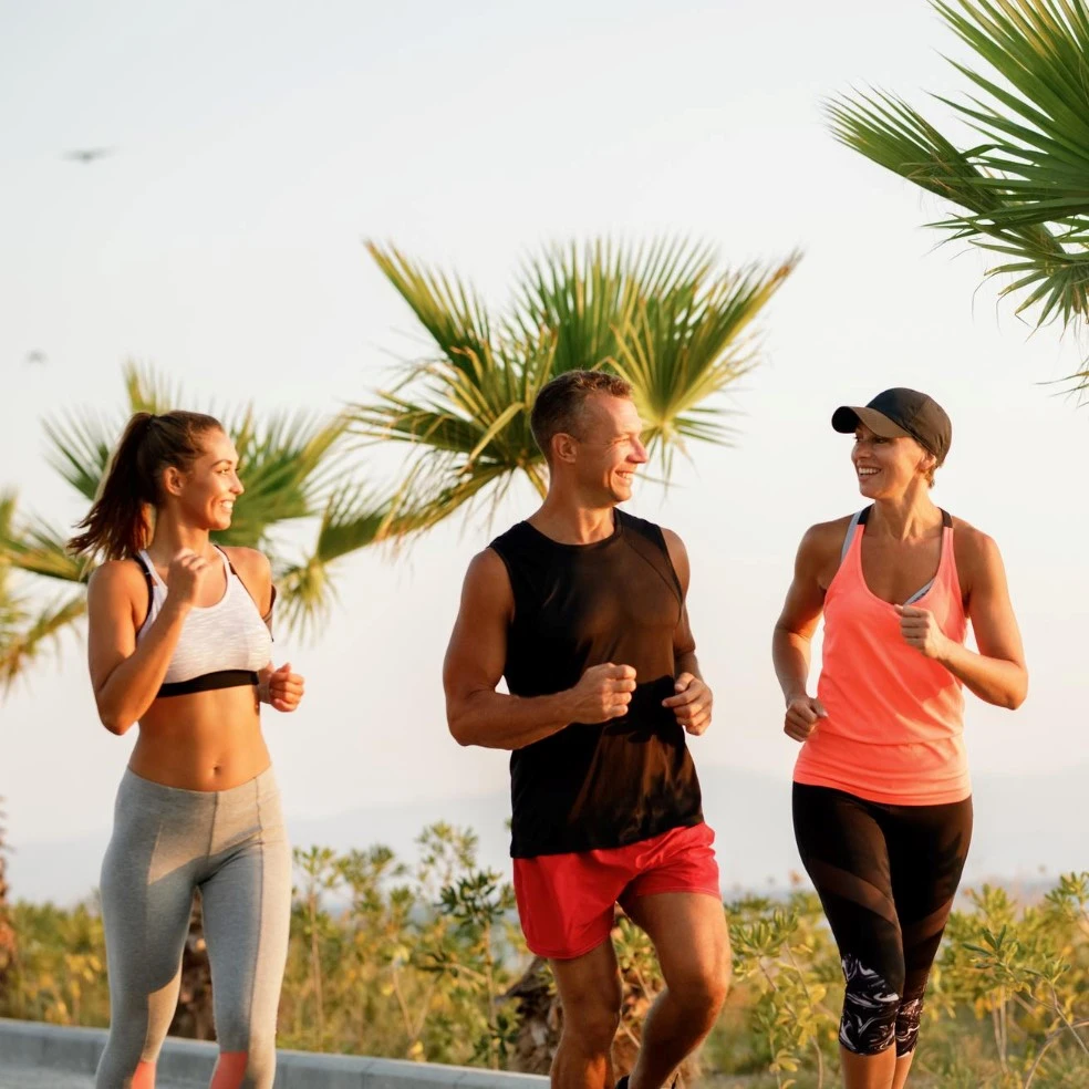 group-happy-athletic-people-jogging-talking-each-other-outdoors (1)